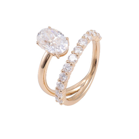 oval cut moissanite engagement ring set in solid 14k rose gold featuring a curved diamond wedding band and solitaire center stone.