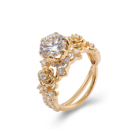 floral round moissanite engagement ring in solid 14k yellow gold featuring rose-inspired diamond accents and split shank design.