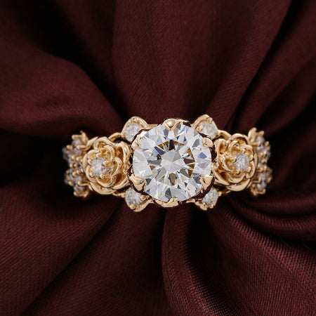 floral round moissanite engagement ring in solid 14k yellow gold featuring rose-inspired diamond accents and split shank design.