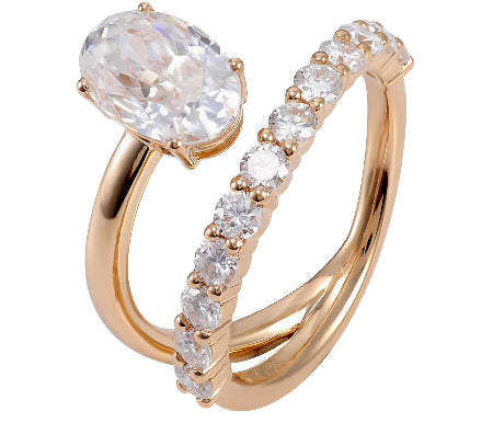 Marquise cut moissanite engagement ring in solid 14K rose gold featuring delicate round diamond accent stones and a six-prong solitaire setting.