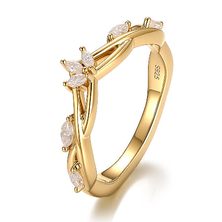 marquise cut moissanite engagement ring in solid 14k yellow gold featuring nature-inspired leaf cluster accents and a unique solitaire setting.