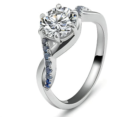 round brilliant moissanite engagement ring with blue sapphire accent in solid white gold