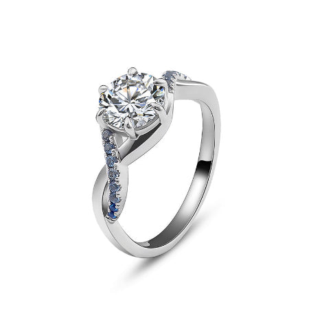 round brilliant moissanite engagement ring with blue sapphire accent in solid white gold