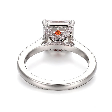 emerald cut moissanite engagement ring in solid 14k white gold featuring a hidden baguette halo and pavé diamond accent band