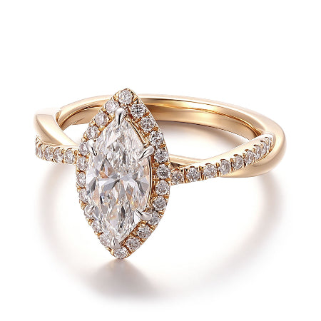 Marquise cut moissanite halo engagement ring in solid 14K yellow gold featuring a twisted pavé band and sparkling halo setting