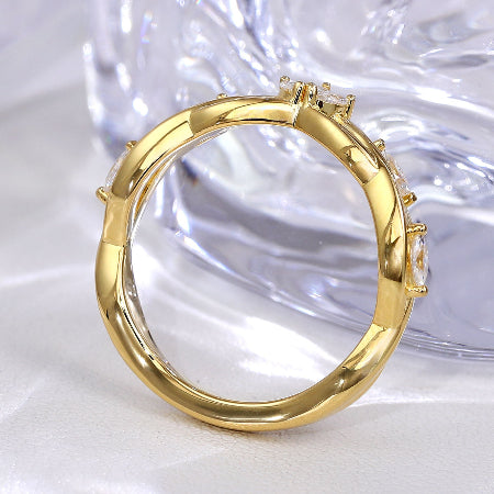 marquise cut moissanite engagement ring in solid 14k yellow gold featuring nature-inspired leaf cluster accents and a unique solitaire setting.