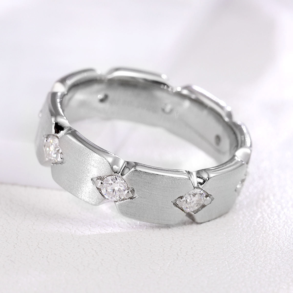 men's 14k white gold moissanite wedding band with brushed matte finish, round moissanite diamonds, and modern geometric hexagon design.