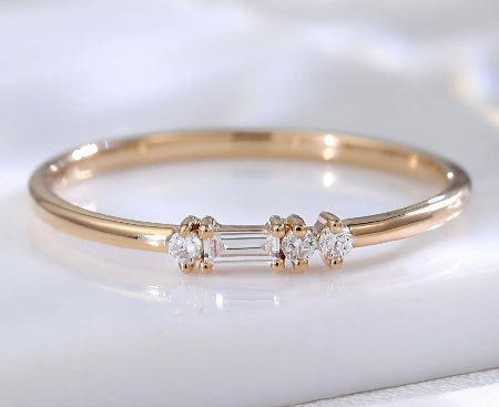 Minimalist 14K solid gold baguette diamond stacking ring with round side diamonds