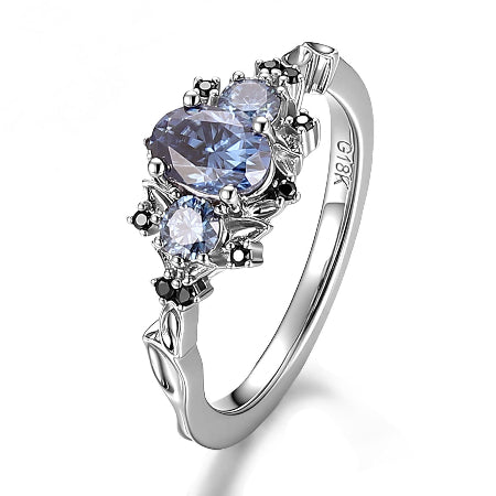 oval blue sapphire three stone engagement ring with black diamond accents in solid white gold for women