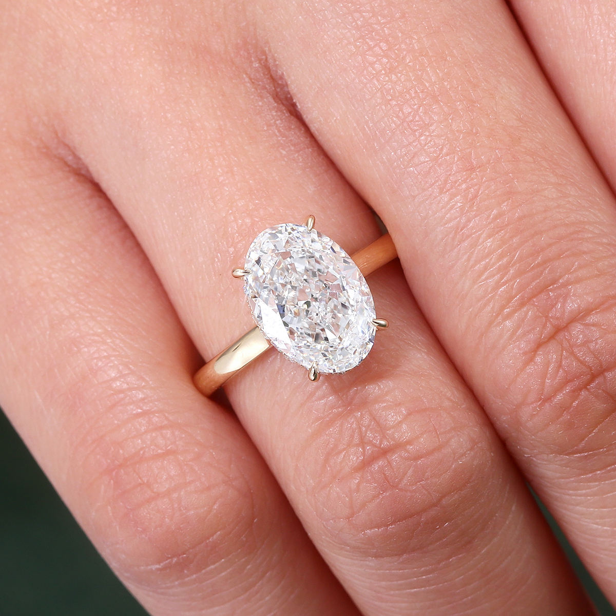 oval cut moissanite engagement ring in solid 14k rose gold with hidden halo solitaire setting for women