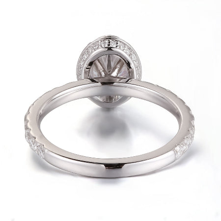 14K solid gold oval halo diamond engagement ring featuring an oval-cut center stone with a pavé diamond band. Elegant solitaire bridal ring available in yellow, white, and rose gold.