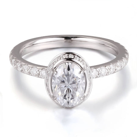 14K solid gold oval halo diamond engagement ring featuring an oval-cut center stone with a pavé diamond band. Elegant solitaire bridal ring available in yellow, white, and rose gold.