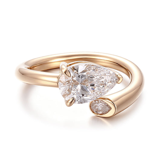 Pear cut moissanite engagement ring in 14K yellow gold with modern open wrap design and bezel accent, perfect for proposal, wedding or promise ring
