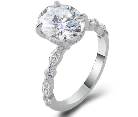 oval cut diamond ring with marquise and round diamond