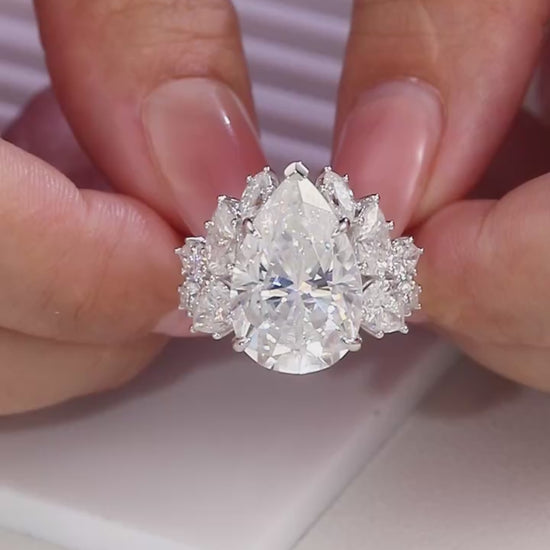 Large trillion cut moissanite engagement ring in 925 sterling silver with pear and round moissanite floral cluster side stones