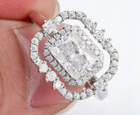 radiant cut double halo engagement ring in 14k white gold featuring moissanite diamond center stone