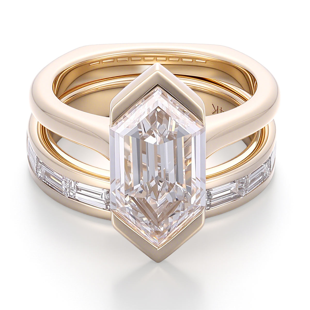 Shield cut moissanite engagement ring set in solid 14K yellow gold featuring a bezel-set geometric center stone and matching baguette wedding band