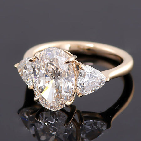 3 tcw oval brilliant cut three stone moissanite engagement ring