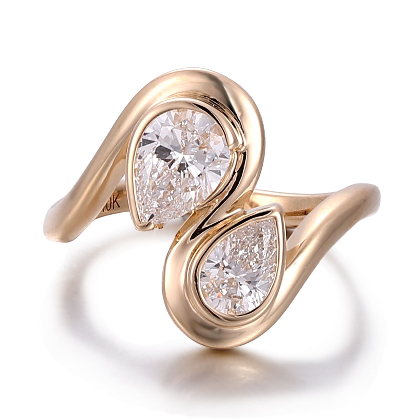 toi et moi pear cut moissanite engagement ring in 10k rose gold featuring a modern open bypass design with two bezel-set pear stones