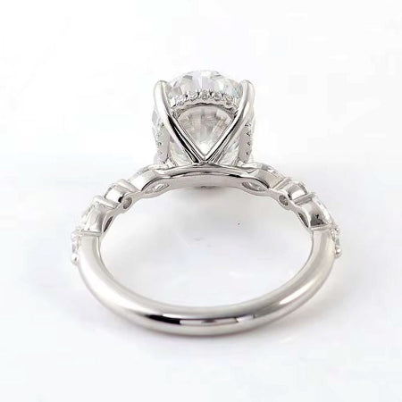 oval cut diamond ring with marquise and round diamond